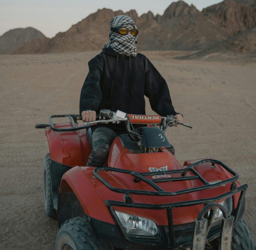 pexels-photo-5976730-5976730 Explore the thrill of quad biking through vast desert landscapes at dawn, capturing the spirit of adventure.